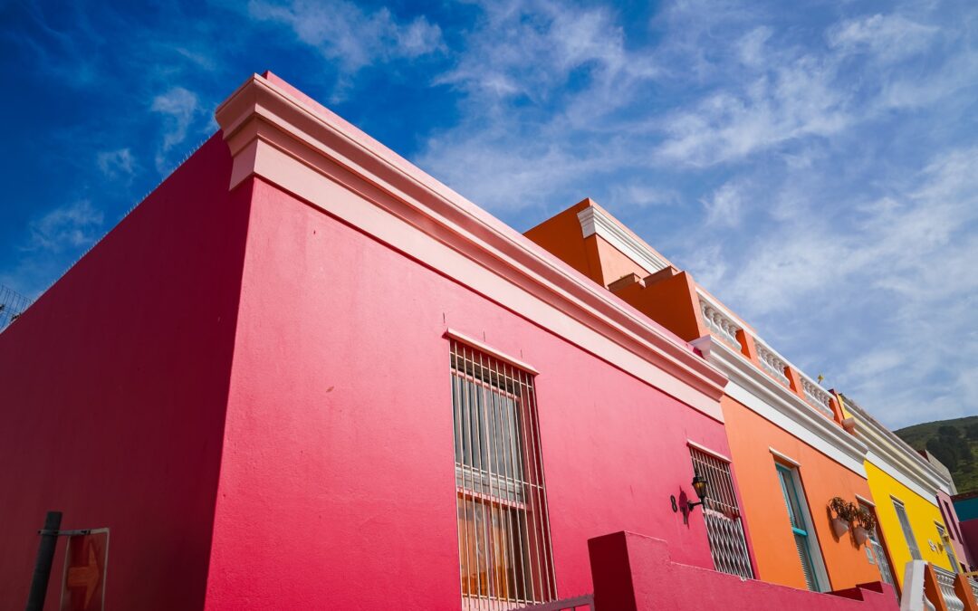 red and white concrete building under blue sky during daytime